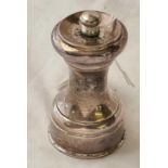 A pepper mill with concave shaped body - 3" high - by JG & S