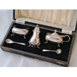 A boxed three piece cruet each on pad feet with spoons - Birmingham by A.Bros - 105 g. excluding