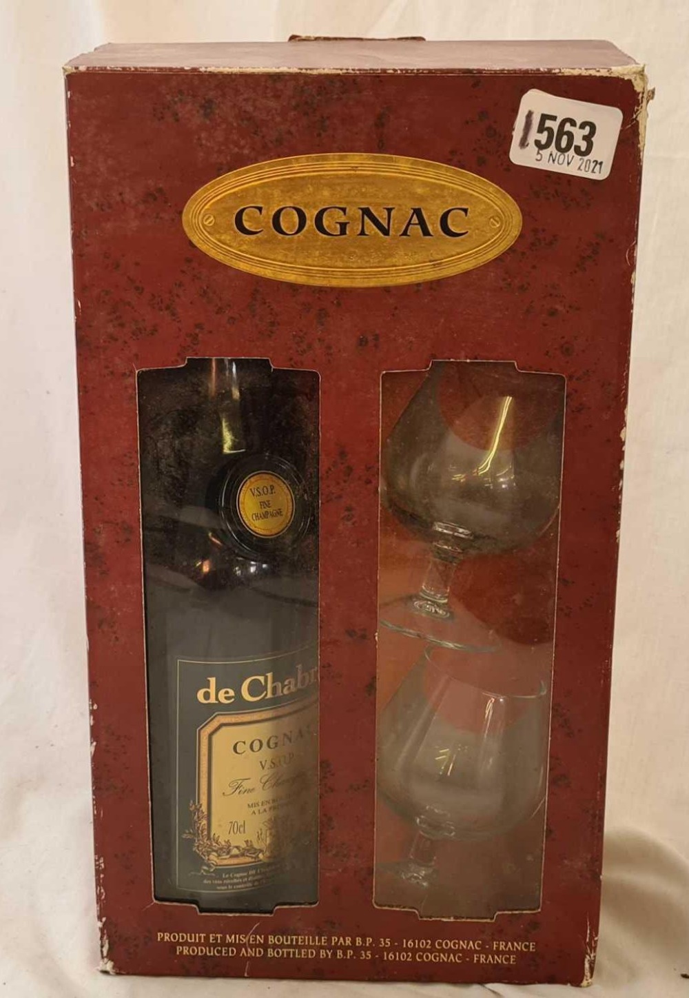 A bottle of Cognac with wine glasses