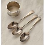 A scroll engraved napkin ring - Birmingham 1911 and three tea spoons - 72 g.