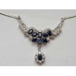 A decorative silver blue and white stone necklace