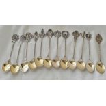 A set of twelve (830 standard) filigree decorated coffee spoons – 67 g.