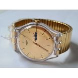 A gents large faced Swatch wrist watch with seconds sweep and calendar dial WO