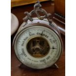 A small brass table barometer