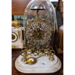 A 19th Century brass skeleton mantle clock with single fusee. Glass dome damaged at base