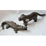 A nutcracker in the form of a crocodile and another in the form of a dog
