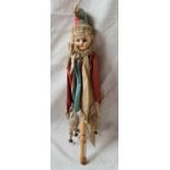 A porcelain headed rattle which squeaks with wooden handle - 14" high