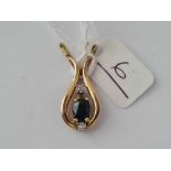 A three stone sapphire and diamond drop pendant set in gold - 2 gms