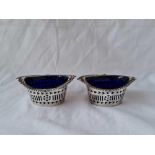 A pair of oval pierced boat shaped salts with B.G.L's, 3.5" long, Sheffield 1909