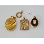 Four assorted gilt lockets etc.