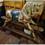 A Victorian rocking horse on a painted trestle shaped base - 42" high