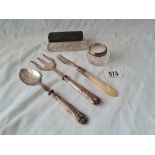 An oblong silver top jar and a silver handle bread fork etc.