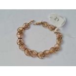 A pierced 10ct gold fancy 7” bracelet 6.8g