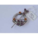 A silver Scottish style brooch set with gem stones