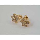 VINTAGE DIAMOND DAISY CLUSTER EARRINGS SET IN 10CT MARKED GOLD, TOTAL. DIAMOND WEIGHT 1.5CTS APPROX