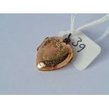 A scroll engraved 9ct back & front heart locket