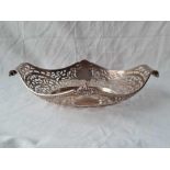 An oval pierced dish with scroll decorated handles - 10" wide - Birmingham 1900 by M&B - 294 g.
