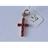 A gold cross set with red stones 1.9g inc