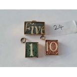 Three 9ct bank charms