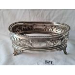 A William IV oval cruet base embossed with scroll work - 7.25" wide - London 1836 by Lias Bros - 218