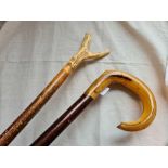 A horn handled walking stick and another