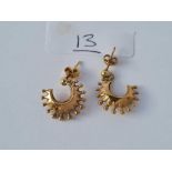 A pair of star shaped earrings 9ct