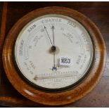 A circular barometer or thermometer - 10" wide