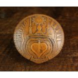 An Early 18th Century North European Boxwood Snuff Box of circular form.