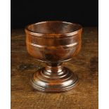 A Fine 18th Century Pole Lathe-Turned Lignum Vitae Wassail or Posset Bowl on a pedestal foot with