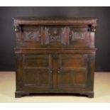 A 17th Century Carved Oak Court Cupboard of good rich colour and patination.