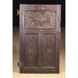 A 17th Century Paneled Oak Cupboard Door.