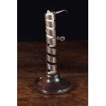 A 19th Century Wrought Iron Candlestick.