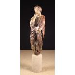 A 14th Century Carved & Polychromed Wood Sculpture of Saint John the Evangelist depicted holding a