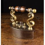 A 19th Century Scottish Box Iron with turned fruitwood handle capped by brass ball finials and