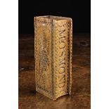 A 19th Century Treen Snuff Box in the form of a Book decorated with chip carving and having a