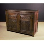 A 17th Century Joined Oak Cupboard enriched with Carving.