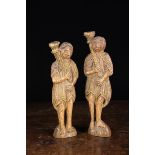 A Pair of 18th Century Naively Carved Wooden Spanish Figural Candlesticks.