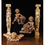 A Group of Ornamental Giltwood Carvings: A pair of Egyptianesque caryatids above tapering lion