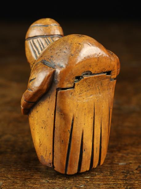 An Early 19th Century Carved Coquilla Nut Snuff Box in the form of grotesque hump backed man with - Image 3 of 3