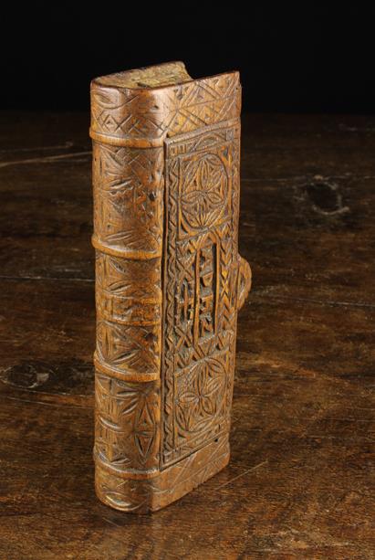 An 18th Century Treen Snuff Box in the form of a Book with sliding lid.