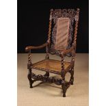 A Charles II Walnut Armchair with caned back & seat.