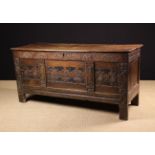 A 17th Century Joined West Country Oak Coffer with carved strap-work decoration.