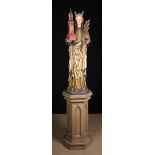 A Fine 19th Century Gothic-Revival Wood Sculpture carved in the round from pine and geossoed with