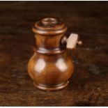A Turned Treen Spice Grinder, 3½" (9 cm) in height.