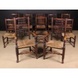 A Set of Ten Rush Seat Spindle-back Dining Chairs including two armchairs,