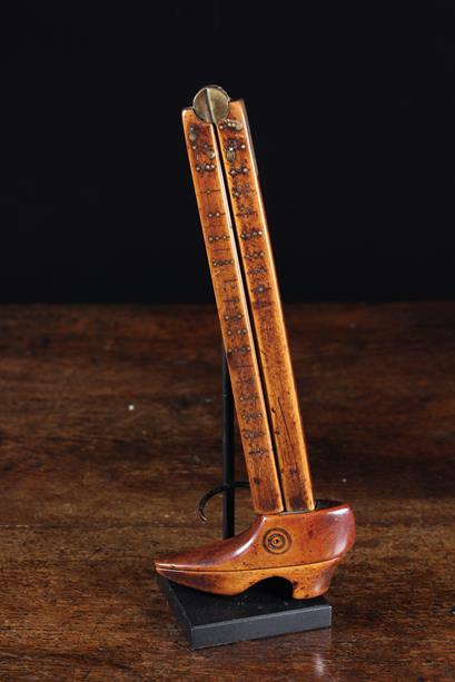 A Rare 18th Century Folding Foot Measure with sliding shoe shaped callipers and incised piqué work
