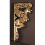 A Good Early 17th Century Carved Oak Figural Bracket in the form of a winged satyr with good colour