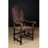An 18th Century Spanish Carved Walnut & Tooled Leather Armchair (A/F).
