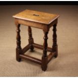 An Antique Joined Oak Stool.