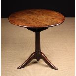 An 18th Century Oak Tripod Table on 'Bird-cage' Support.